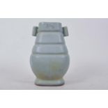 A Chinese duck egg blue glazed pottery vase with twin lug handles, 7½" high