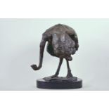 A bronze figure of an ostrich on an oval marble plinth, signed, 14" high