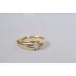 An 18ct yellow gold single stone diamond ring in a clasped hands setting, approximately 25 points