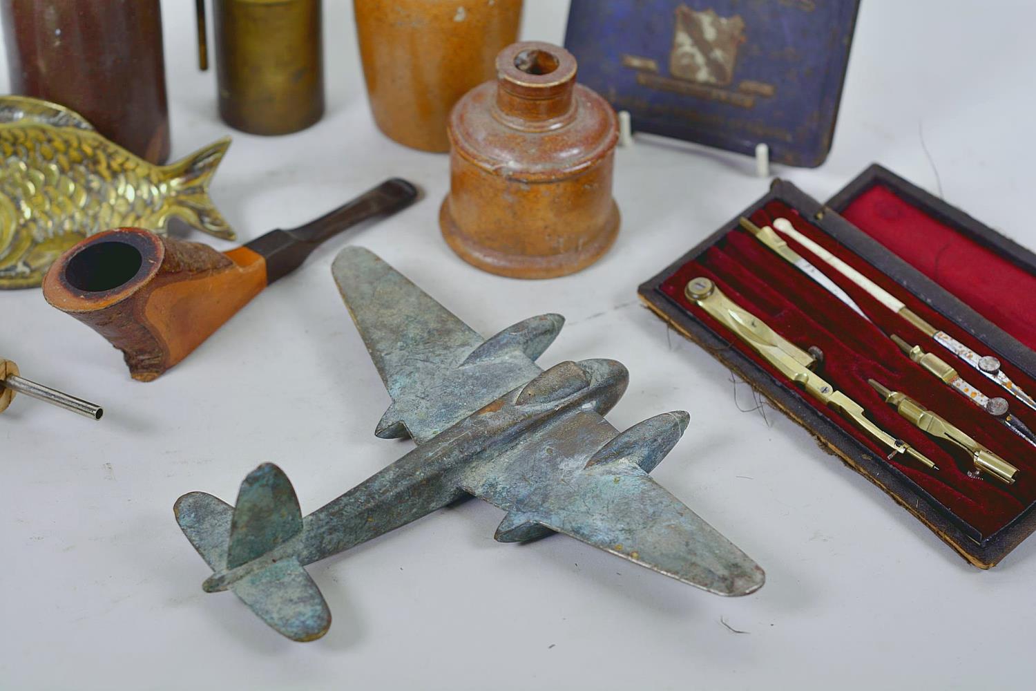 A box of collectables including a brass model Mosquito aircraft, Royalty cigarette tin, drawing set, - Image 5 of 11