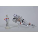 A 1950s Russian ZHK Plonne Factory porcelain figure of a traditionally dressed Soviet goalkeeper