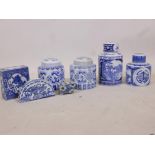 Four Chinese blue and white ceramic canisters and lids, flower brick and two others, largest 9"