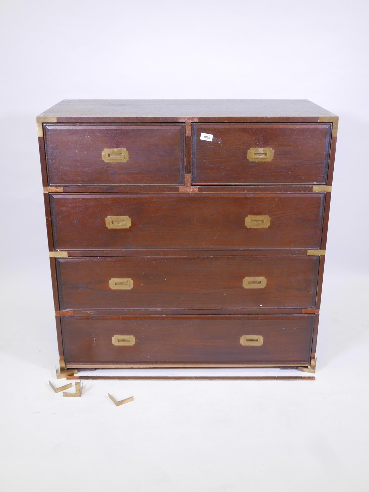 A mahogany military style chest of two short and three long drawers with brass bound corners,