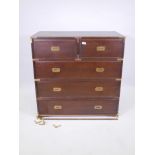 A mahogany military style chest of two short and three long drawers with brass bound corners,