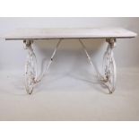 A marble topped cast iron conservatory table, 63" x 27½", 33" high