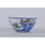 A Chinese doucai porcelain tea bowl with chicken decoration, 3" diameter, 6 character mark to base