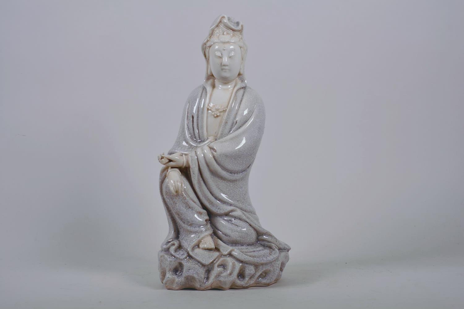 A Chinese crackle glazed blanc de chine Quan Yin, impressed seal marks verso, 12" high