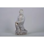 A Chinese crackle glazed blanc de chine Quan Yin, impressed seal marks verso, 12" high