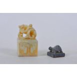 A Chinese carved hardstone seal with kylin decoration, together with a small bronze tortoise seal,