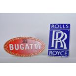 A cast metal Rolls Royce advertising sign, 7" x 11½", together with an oval cast metal sign for