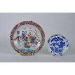A Chinese famille rose cabinet plate decorated with figures in a landscape, together with a blue and