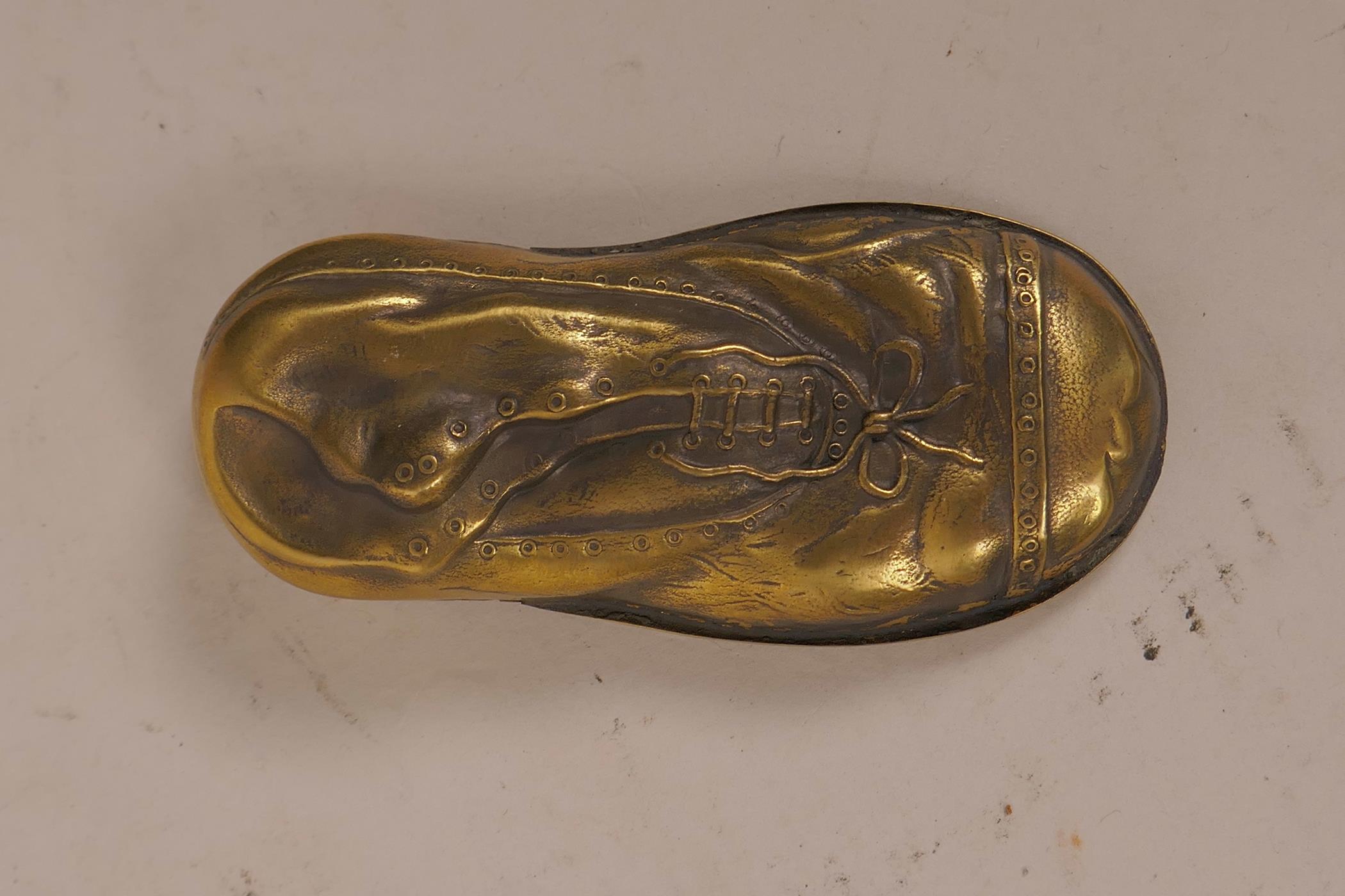 A novelty brass vesta case in the form of a lady's shoe within a shoe, 3" long - Image 2 of 3