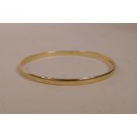 A 9ct gold bangle, 2½" diameter, 9.4 grams