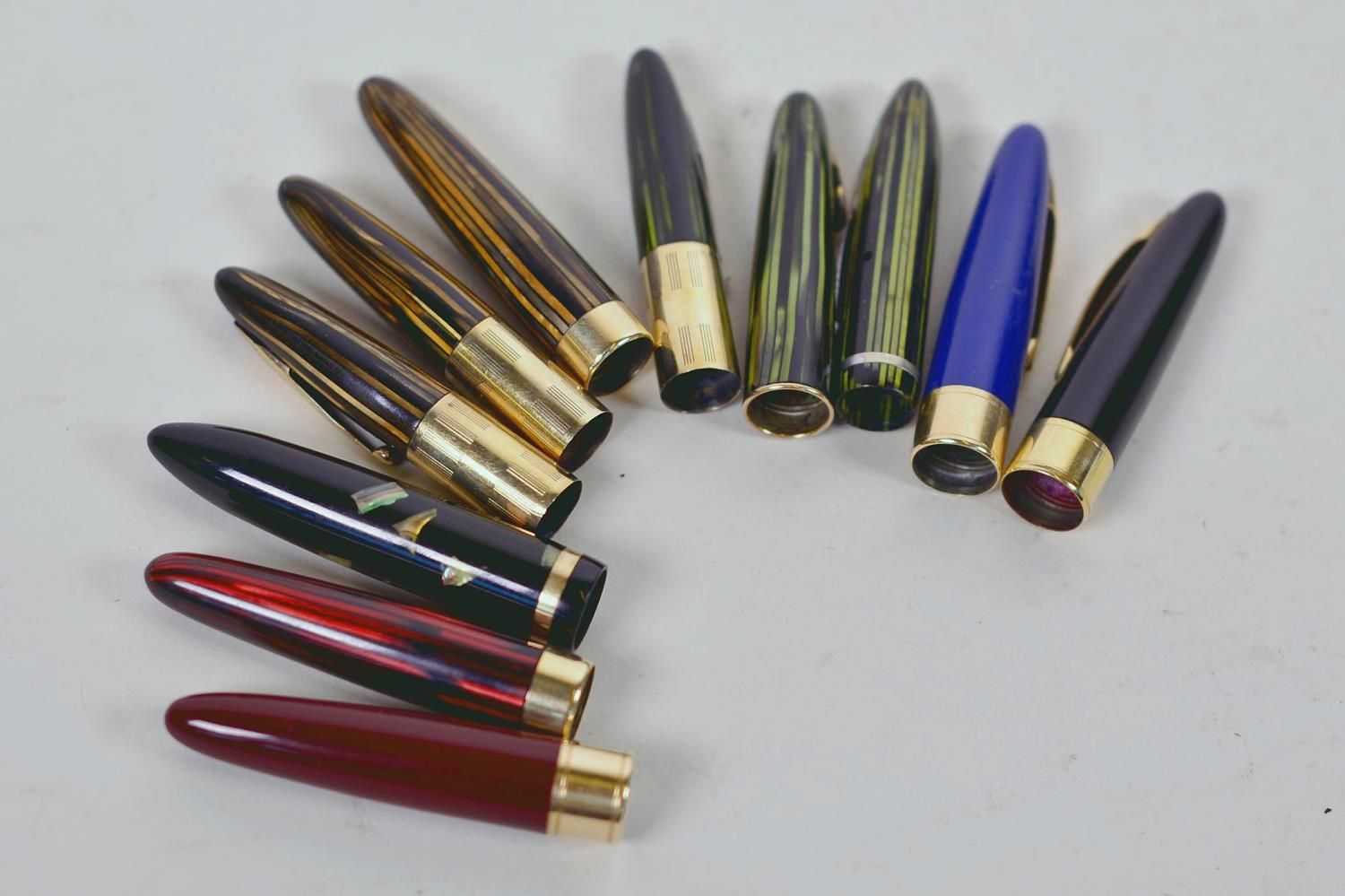 A collection of eleven vintage fountain pen caps