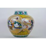 A Japanese polychrome porcelain globular vase decorated with traditional dough pounders, signed to