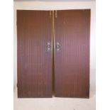 A pair of large mahogany framed doors with decorative moulded panels and brass handles, 32" wide x