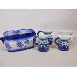 A Staffordshire flow blue style ceramic foot bath, three graduated jugs and a C20th Dresden