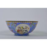 A Chinese Canton enamelled copper bowl with decorative panels depicting birds amongst flowers, 4