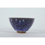 A Chinese Jian kiln bowl with high fired blue drip glaze, impressed character mark to base, 5¼"