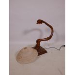 A carved wood table lamp with frosted glass shade, 22½" high