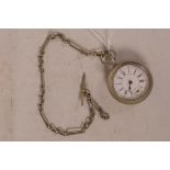 An unusual German steel cased pocket watch, with spring release mechanism having white enamel dial