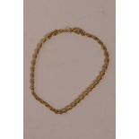 A 9ct gold twisted rope link bracelet, 8" long with safety chain, 5.1 grams