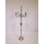 A large chrome plated four branch floor standing candelabra, 58" high
