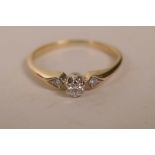 A 9ct yellow gold diamond ring, the central stone flanked by diamond shoulders, size 'K/L'