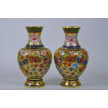 A pair of Oriental cloisonné vases decorated with dragons, 8" high