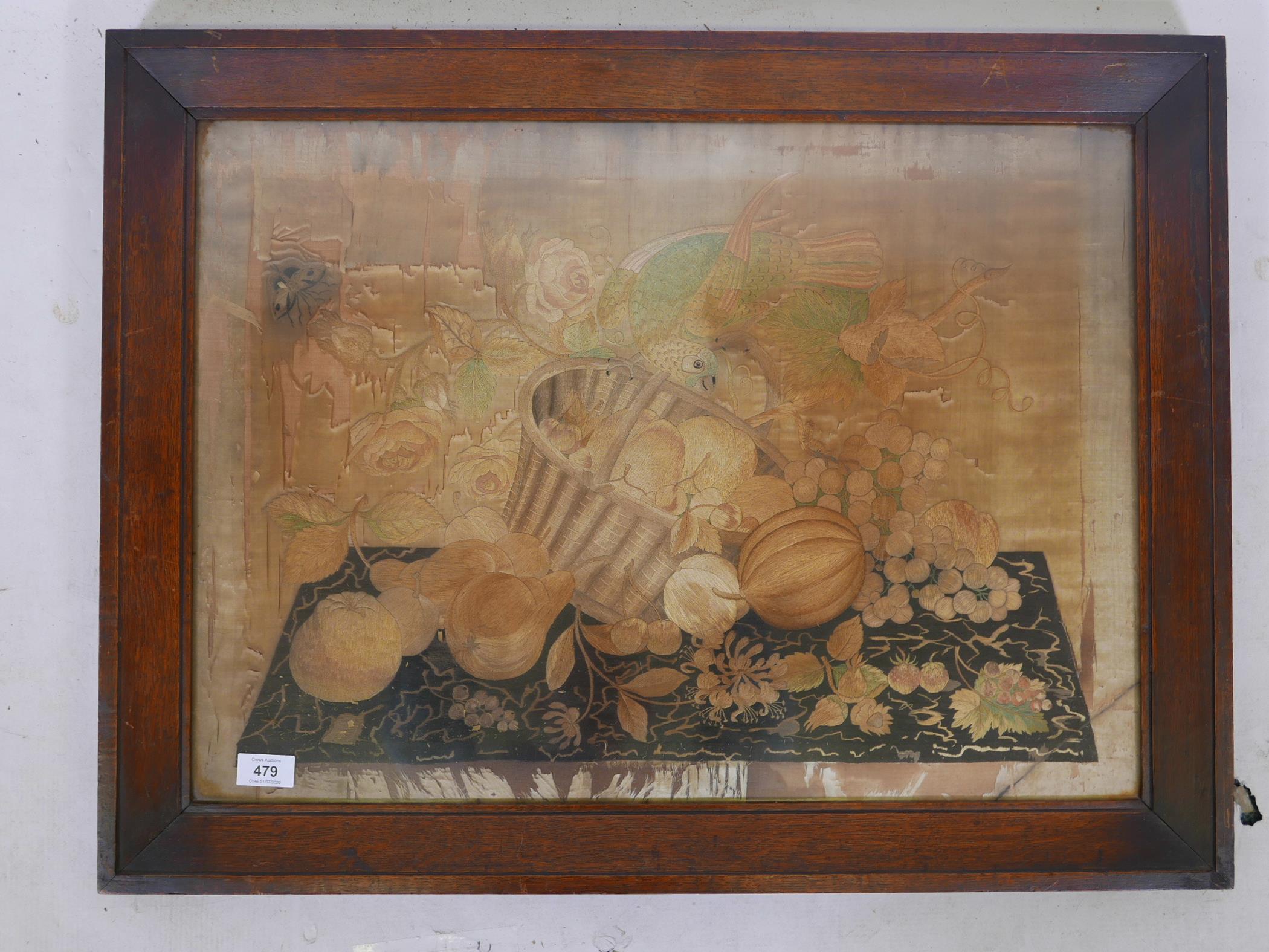 A Regency silkwork depicting a parrot in a bowl of fruit, in an oak frame, 23" x 30" - Image 2 of 4