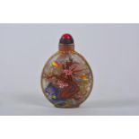 A Chinese glass snuff bottle with polychrome decoration of birds and flowers, 4 character mark to