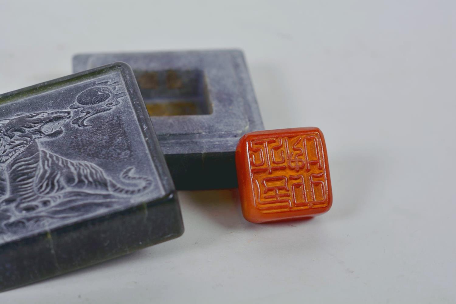 A Chinese green soapstone box containing an amber stone seal, the cover carved with a tiger, 6 - Image 2 of 9