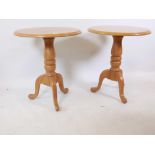 A pair of oak occasional tables raised om turned columns and tripod supports, 24" diameter