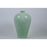 A Chinese celadon green glazed porcelain meiping vase with underglaze lotus flower decoration, 6