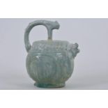 A Chinese celadon ware pourer with animal head spout, 7½" high