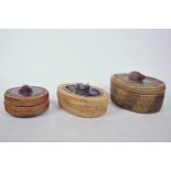 Three small Oriental basket weave boxes with carved hardwood decoration to lids, largest 6½" x 5"
