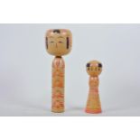 Two Japanese turned wood 'kokeshi' dolls, largest 9½"