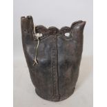 An C18th (possibly older) Ottoman leather flask, 15" high x 10" wide, A/F