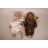 A vintage composition doll in knitted clothing, together with a vintage North American Indian