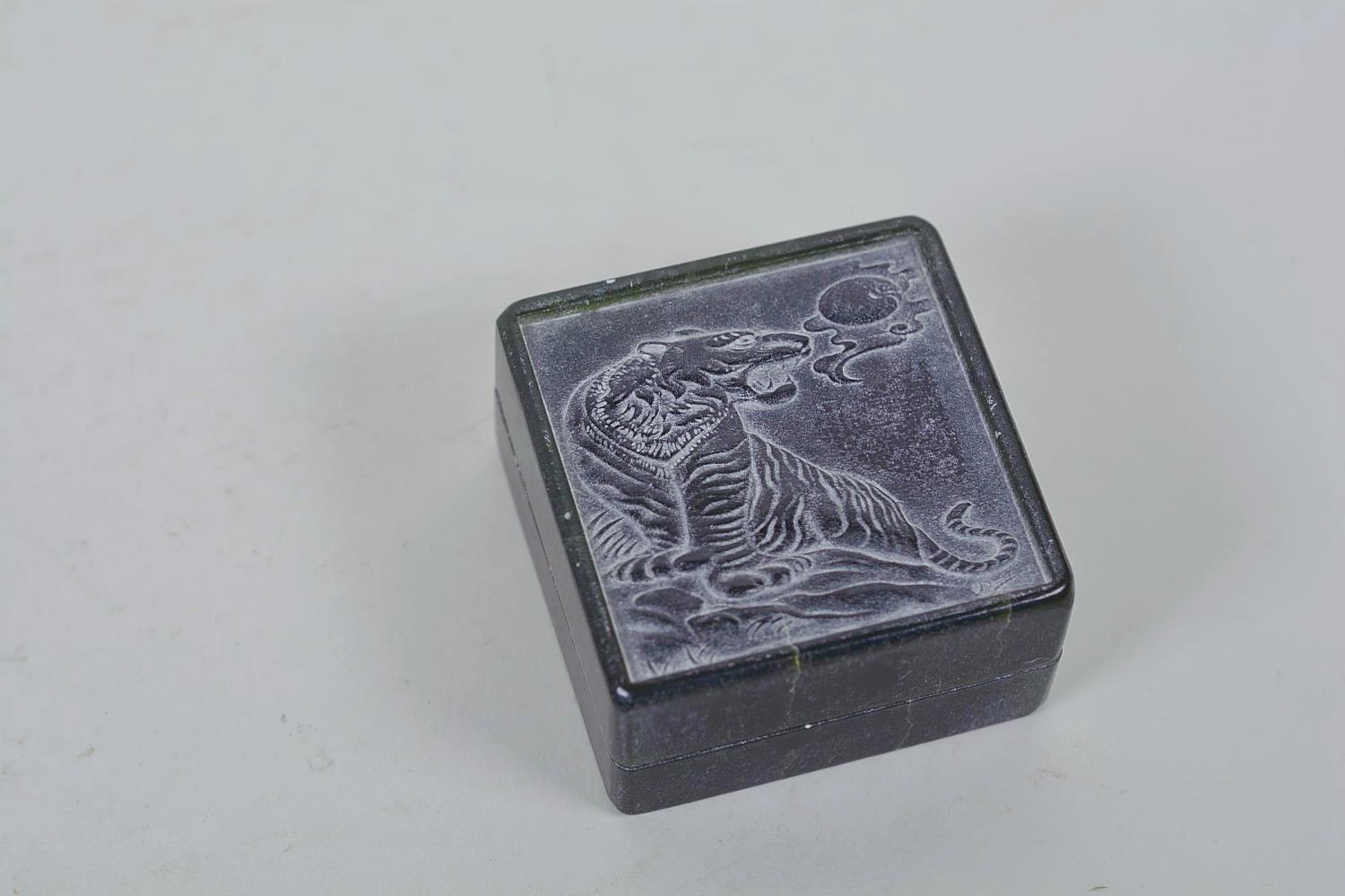 A Chinese green soapstone box containing an amber stone seal, the cover carved with a tiger, 6 - Image 9 of 9