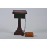 A miniature wooden lectern with chained miniature Holy Bible containing the Old and New Testament,
