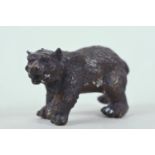 A small cast bronze figure of a brown bear, 7" long