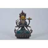 A Tibetan mixed metal figure of Shiva, with polychrome painted patina, 8" high