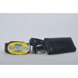 A Superdry leather belt with enamelled motor oil buckle, 43" long, together with a faux crocodile