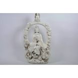 A large blanc de chine Quan Yin, impressed marks verso, 20" high x 11" wide