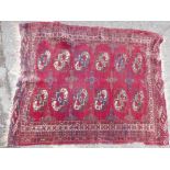 A deep red ground Bokhara pattern rug, A/F, 50" x 42"