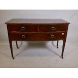 A Victorian mahogany bow fronted side table with two over one long drawer, raised on tapering