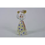 A 1960s Russian Dulevo factory porcelain figure of a traditional Soviet girl holding a wheatsheaf