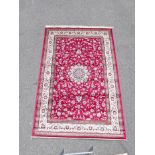 Red ground Kashmir rug with traditional Shabaz medallion design, 60" x 89"