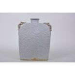 A Chinese rectangular green glazed porcelain flask with embossed decoration of exotic birds and